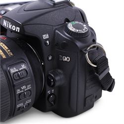 Nikon D90 DSLR camera body, serial no. 8230680, with a Nikon ED AF-S Nikkor 70-300mm 1:4.5-5.6 G lens, serial no. 3102829, with battery and Nikon Quick Charger, in carry case with other accessories including hoods, caps and filters