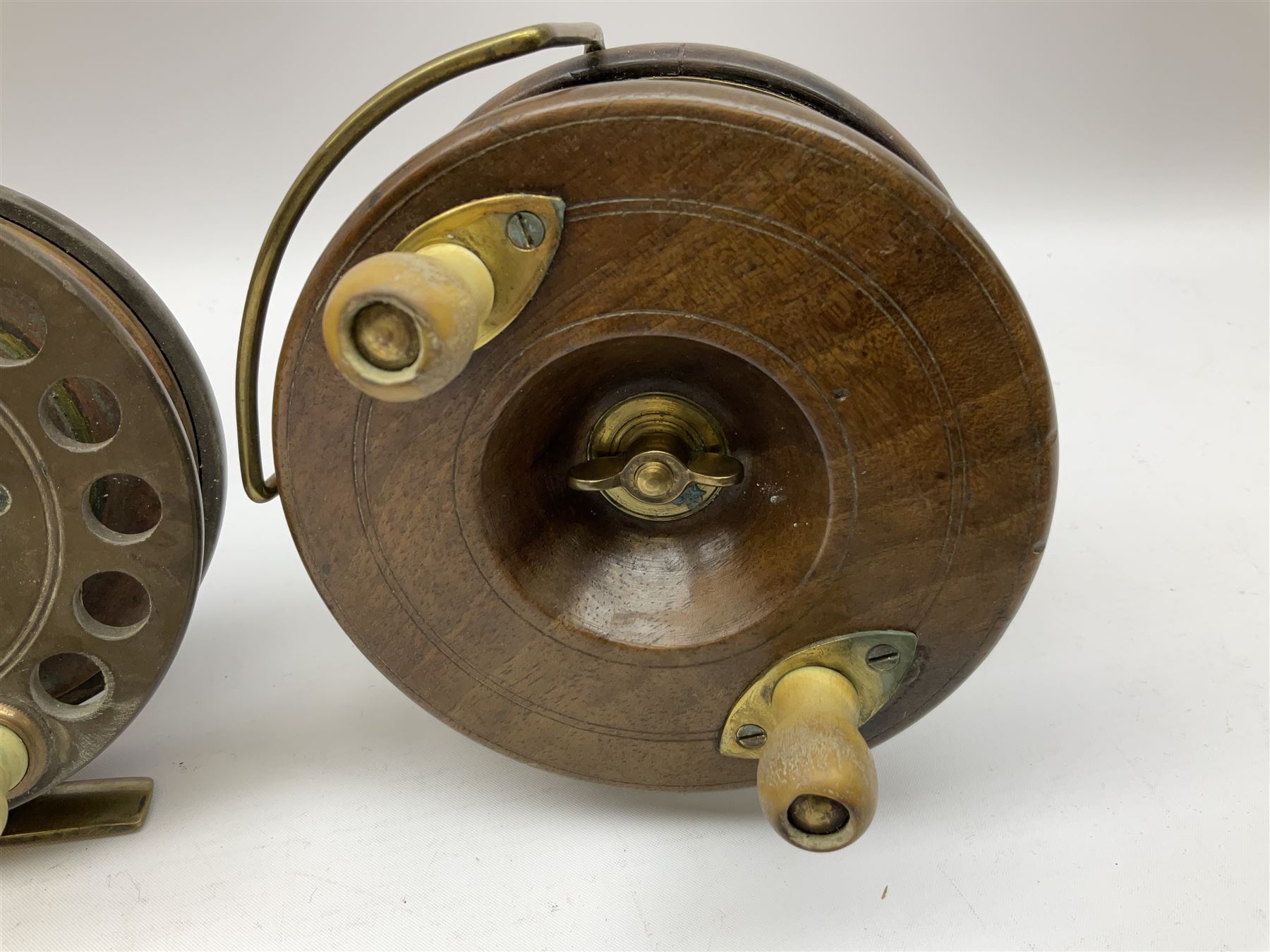 Three Allcocks & Co Ltd reels of brass and wood construction, the largest D4.5 inches