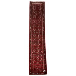 North West Persian Malayer runner, red ground field decorated with Herati motifs, guarded border decorated with trailing flowerhead band 