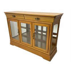 Yew wood sideboard, rectangular top with mahogany and ebony stringing, fitted with two drawers over three glazed cupboard doors enclosing glass shelves