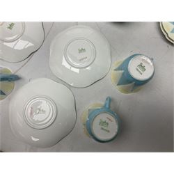 Shelley Dainty pattern tea wares, of lobed form with blue star decoration on merging white and yellow ground, comprising five teacups, five saucers, six tea plates, milk jug and cake plate, all with printed green mark beneath, some with painted pattern no 11770