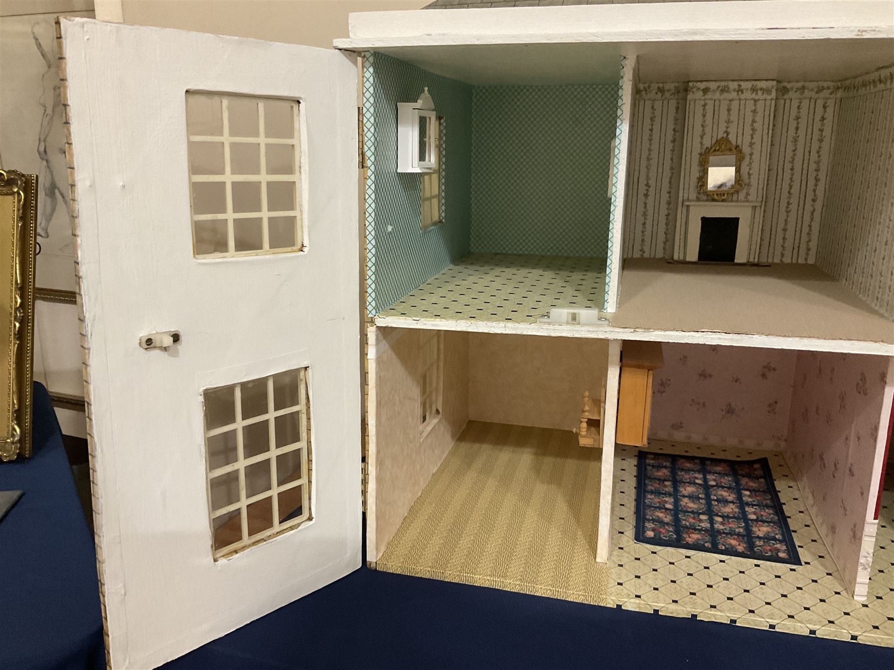 Modern scratch-built Palladian style wooden dolls  house as a 19th century double fronted two-storey property with simulated brick and stone walls under a removable simulated slate hipped roof; the triple hinged front elevation opening to reveal six rooms with central hall, stairs and landing L94cm H56cm D40cm