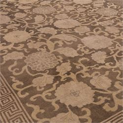 Indian Khetar hand knotted carpet, the brown ground decorated with an all over scrolling foliate and palmette design, enclosed within a conforming floral border with guard stripes