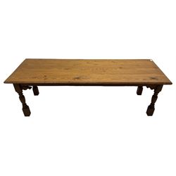 Large Victorian pitch pine farmhouse table, rectangular top with shaped edge, over a shaped apron, raised on turned supports
