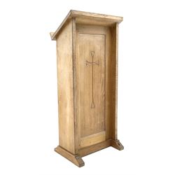 'Mouseman' oak ecclesiastical lectern, sloped book rest over panelled front carved with cross, plain end supports on sledge feet, the right hand sledge carved with mouse signature, by Robert Thompson of Kilburn