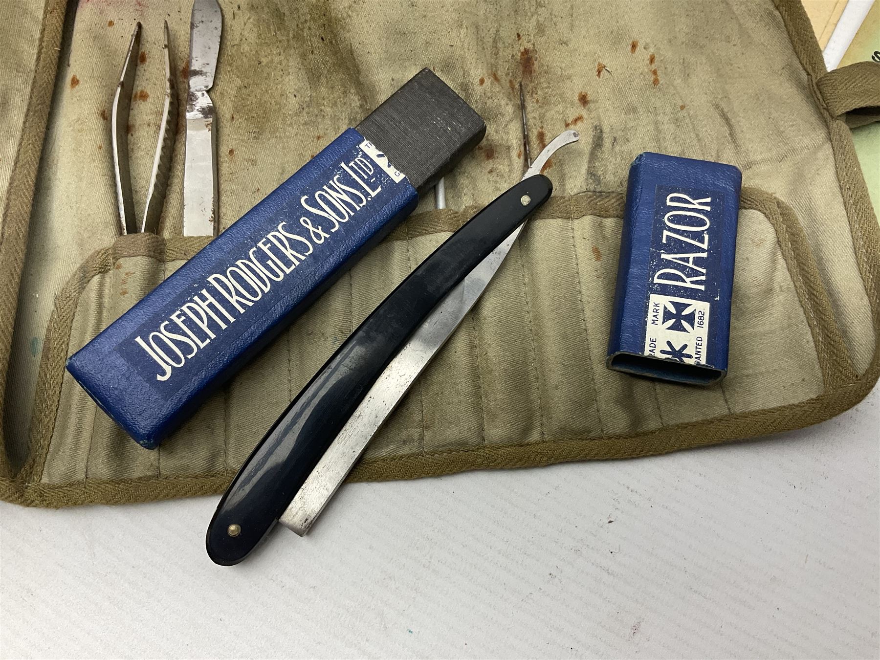 Collection of nineteen British Army booklets 1940s - 1970s including Small Arms Training 1944, various Infantry Training, Cadet Training Manual 1978, Signal Training, Commander's Aide Memoires etc; 1950s blue beret with Yorks Brigade badge; part travelling toilet set in cloth roll; all contained in pine box with webbing straps