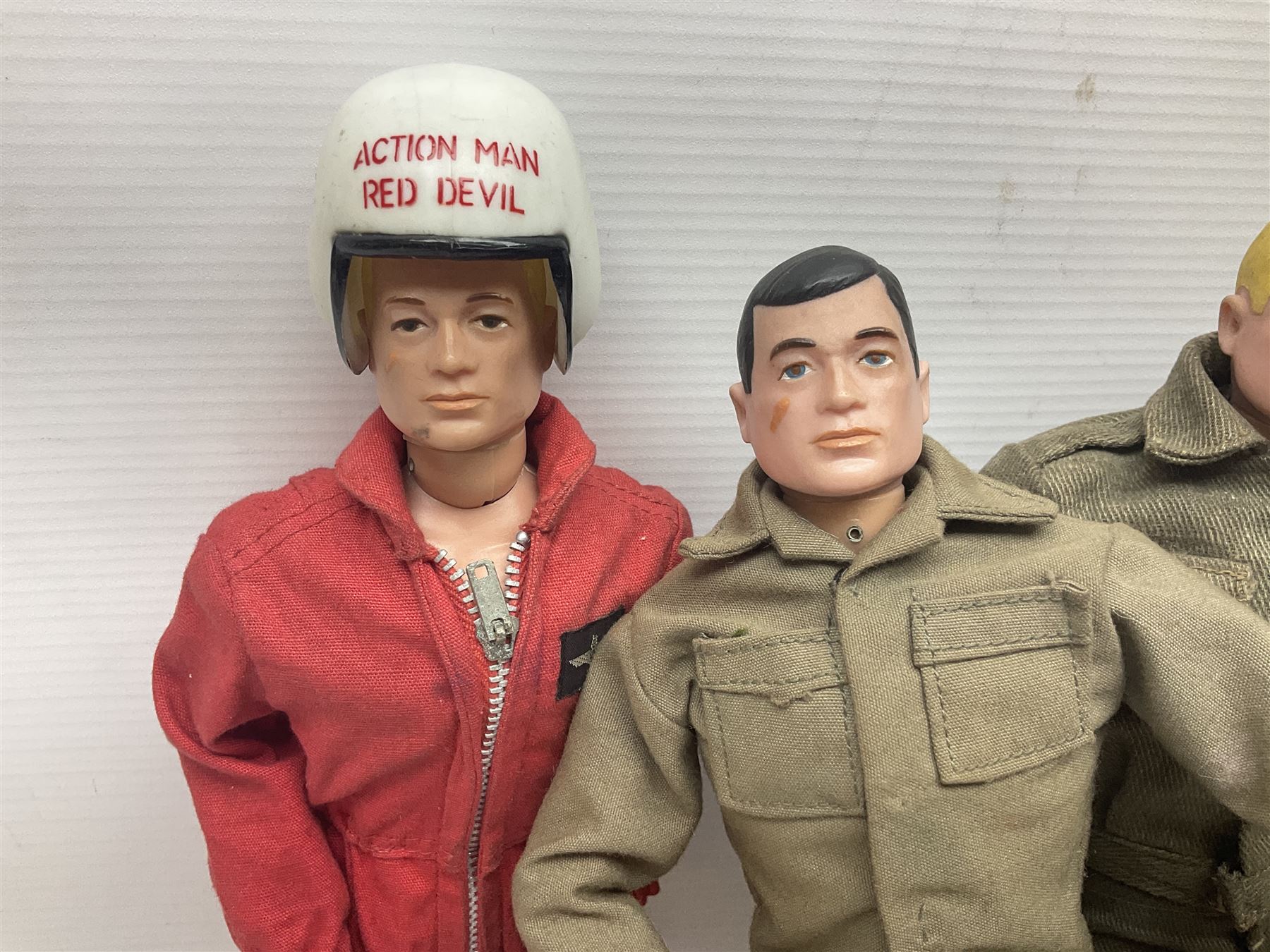 Action Man - five figures marked on the back 'Made in England by Palitoy under licence from Hasbro 1964', one dressed as a German Stormtrooper, one as a Red Devil Pilot and three in army uniform; another similar action figure marked to the right buttock ' G.I. Joe Copyright 1964 by Hasbro Patent Pending Made in Canada' dressed in army uniform; together with an Action Man jeep, field gun, mortar and machine guns and other accessories including helmets and weapons, parachute, diving equipment, skis and snow shoes, boots, uniforms etc; all unboxed