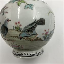 Pair of Chinese Republic porcelain vases, each painted in Famille Rose enamels with pairs of pigeons amidst peony, rock, flowering plants and leafy branches, possibly Qianlong seal beneath, H22cm 