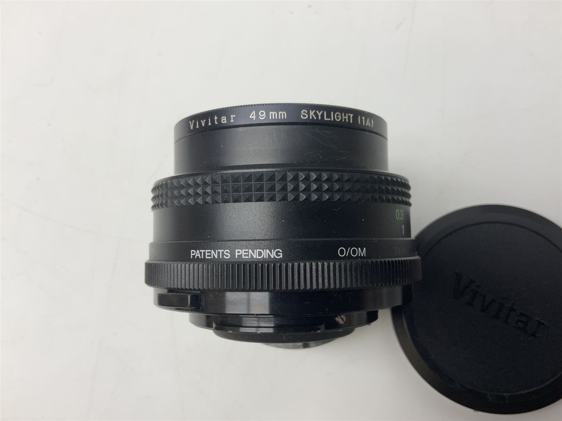 Olympus OM-1 camera body, serial no 913212, with 'Olympus OM-System F.Zuiko Auto-S 1:1.8 f=50mm' lens, serial no.74374, 'Vivitar wide angle MC 28mm 1:2.8 49mm' lens, serial no. 42042268, and Olympus OM winder 2