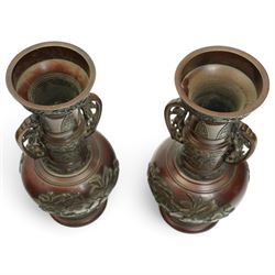 Pair of Japanese two-handled bronze vases, of baluster form with elongated neck, decorated with a raised pattern of birds and flowers, H26cm (2)