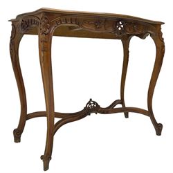 French design walnut console table, shaped top with inset grey marble panel, the frieze pierced and carved with scrolling foliage and applied flower heads, raised on cabriole supports with cartouche carved knees, united by shaped X-stretcher