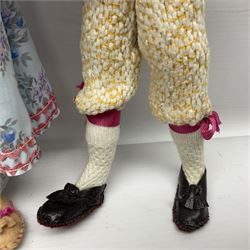 Anna Meszaros Hungary - five hand made needlework figurines including goose girl with stick H20cm; shepherdess in a sitting pose playing a penny whistle with a lamb on her knee; young girl holding a flowerpot; and two others (5)  Auctioneer's Note: Anna Meszaros came to England from her native Hungary in 1959 to marry an English businessman she met while demonstrating her art at the 1958 Brussels Exhibition. Shortly before she left for England she was awarded the title of Folk Artist Master by the Hungarian Government. Anna was a gifted painter of mainly portraits and sculptress before starting to make her figurines which are completely hand made and unique, each with a character and expression of its own. The hands, feet and face are sculptured by layering the material and pulling the features into place with needle and thread. She died in Hull in 1998.