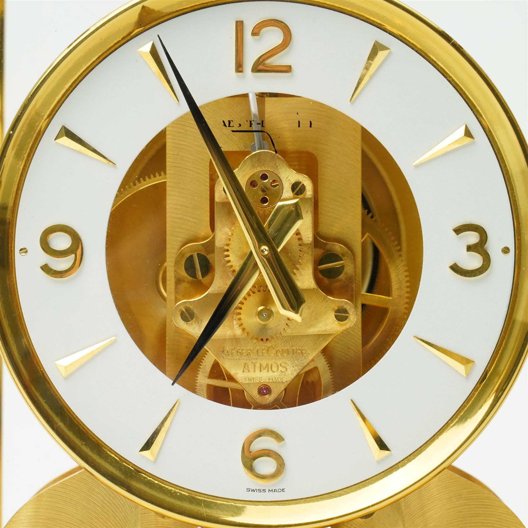 Jaeger- LeCoultre Atmos clock No.291241, with white dial in brass and five glass case and outer carrying case with instruction booklet and original receipt dated 1970 H22cm
