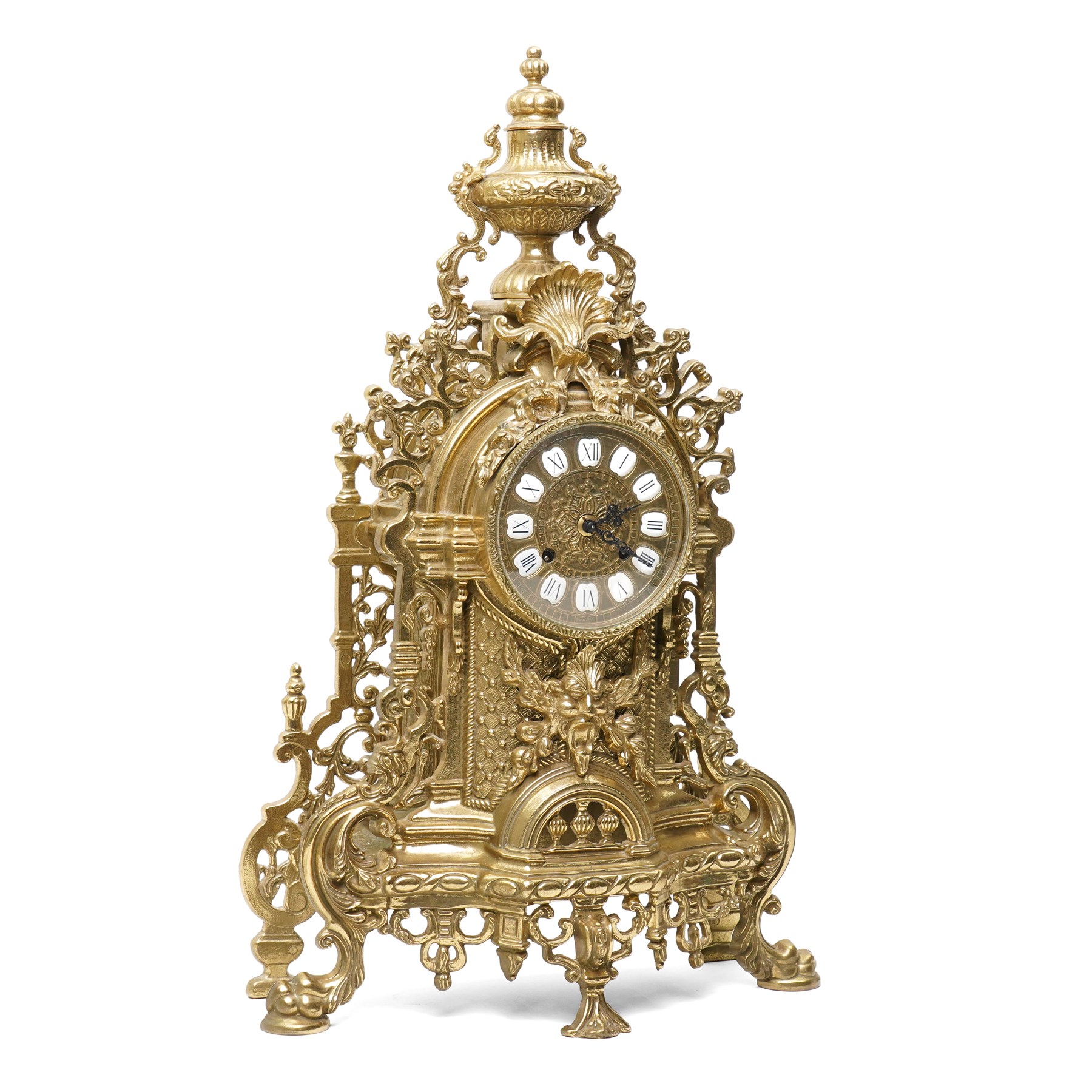 19th century design mantel clock, the brass dial with porcelain numerals, bell strike in brass case of rococo design with urn finial H60cm