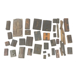 A collection of various Vintage woodblock letter stamps. 