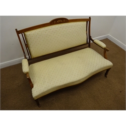  Edwardian inlaid two seat sofa, raised shaped back, upholstered back, arms and seat in beige patterned fabric, square tapering supports on spade feet, castors, W137cm  