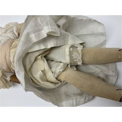 Victorian wax shoulder head doll with pale complexion, applied hair, inset glass eyes and fabric covered jointed body with kid leather lower arms; white linen dress and undergarments H50cm