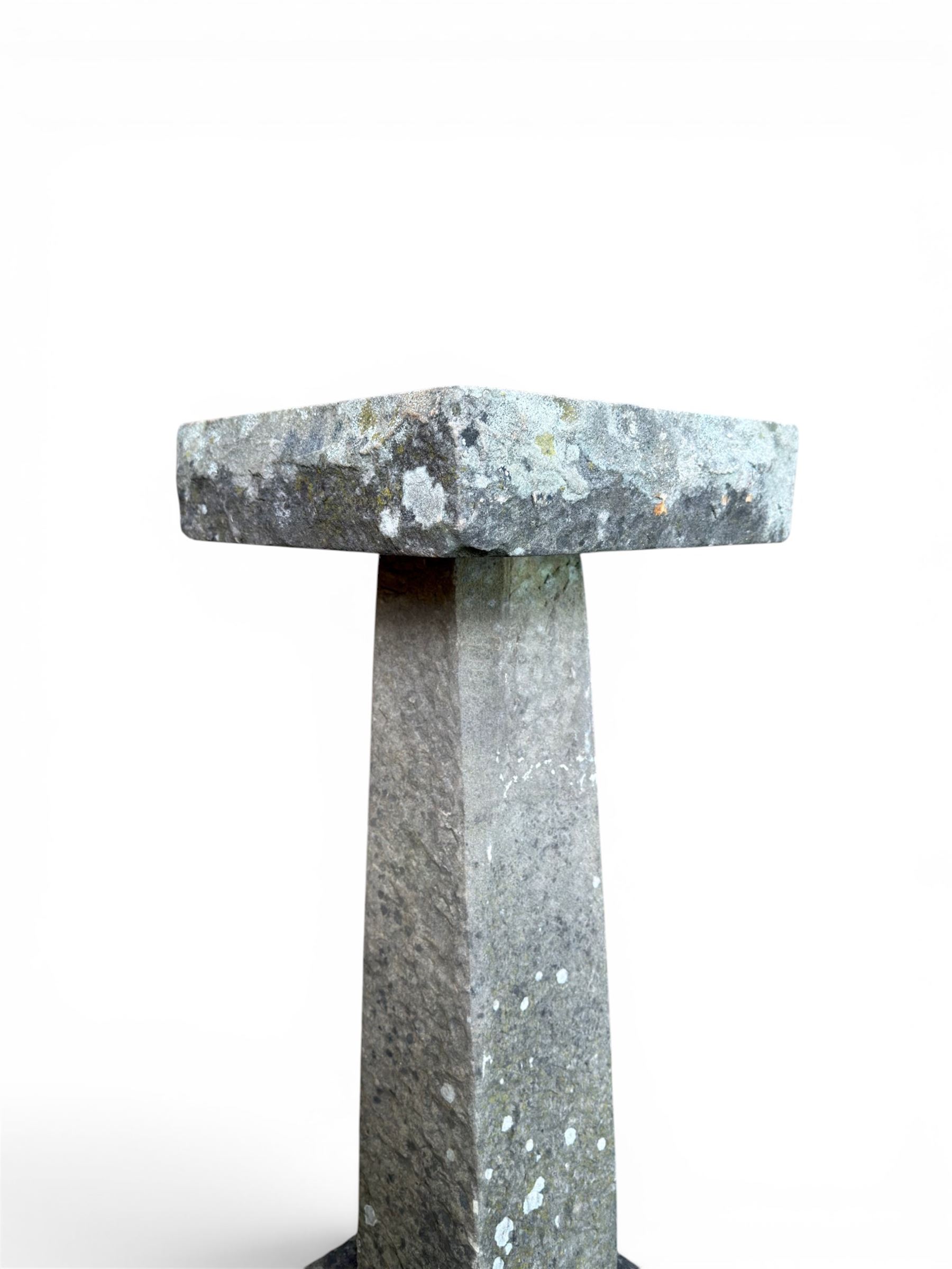 19th century weathered sandstone birdbath, formed in four sections, square top with carved shell bath, raised on tapering column with stepped base