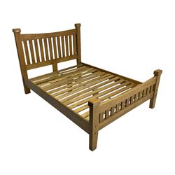 Contemporary solid light oak double bedstead, slatted headboard and footboard, raised on square supports