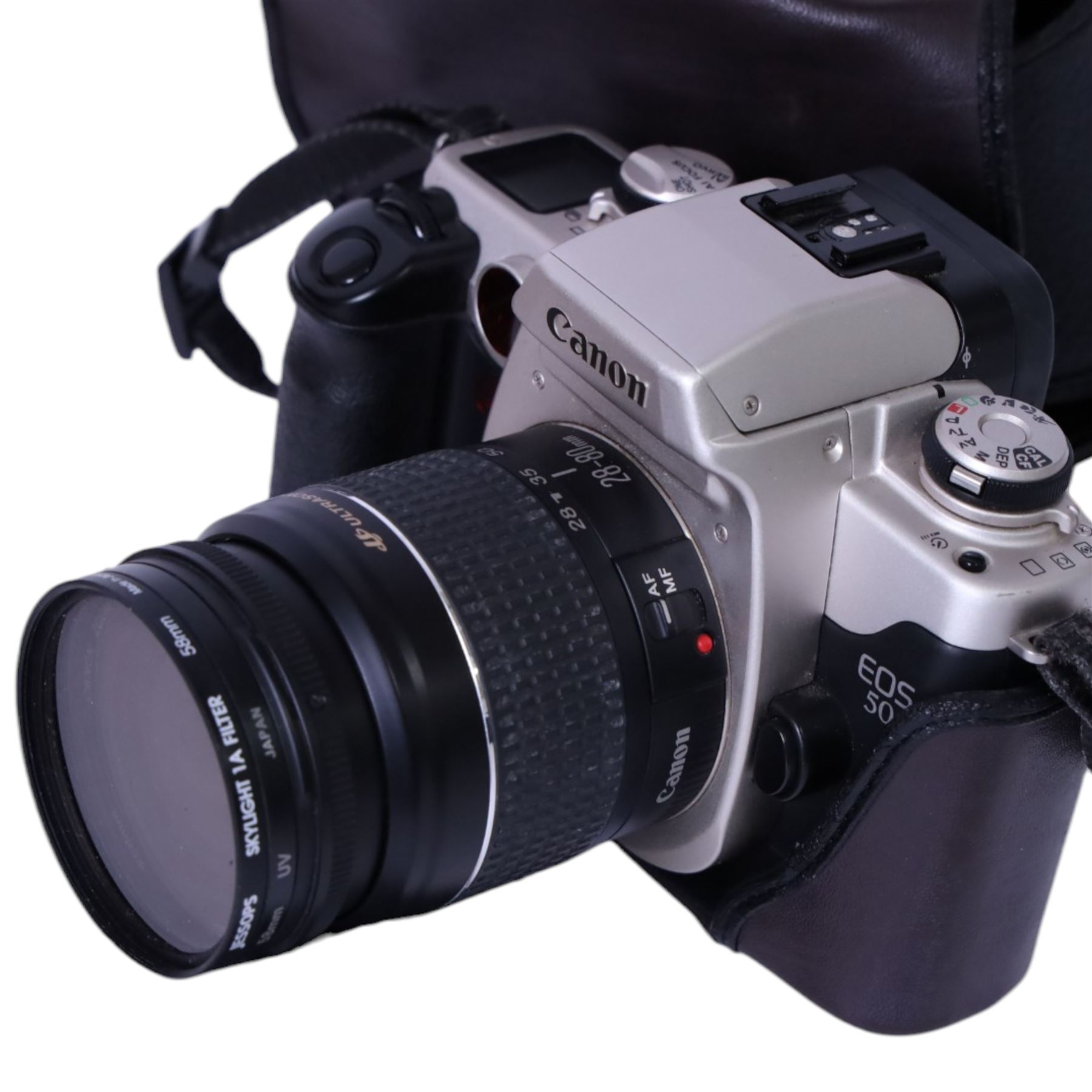 Three 35mm film SLR cameras, comprising Canon EOS 50E camera body with a Canon Ultrasonic EF 28-80mm 1:3.5-5.6 lens, together with a Canon EOS 600 camera body with a Sigma UC 28-70mm 1:3.5-4.5 lens and a Praktica MTL5 with a Carl Zeiss Jena DDR MC Flektogon 2.4/35 lens