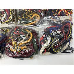 Approximately one-hundred and twenty lanyards in military colours, various styles