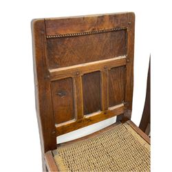 'Gnomeman' set of three oak dining chairs, panelled backs over curved seat rails with drop in rope rush seats, turned front supports with collar joined by plain stretchers, two with carved seated gnome figures, painted

Provenance - This collection of early 'Gnomeman' furniture comes to us directly from the Whittaker family. The pieces were made by the vendor's father Thomas Whittaker in the 1930/40s for his own use. During this time, he lived in York and made items for himself and friends. Whittaker adopted the gnome as a signature and trademark after his move to Littlebeck, Whitby.