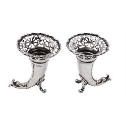 Pair of small Edwardian silver cornucopia vases, of trumpet form with flared and pierced rims, supported upon shell scroll feet and dolphin tails, hallmarked Goldsmiths & Silversmiths Co Ltd, London 1903, H8cm, 3.35 ozt (104.1 grams)
