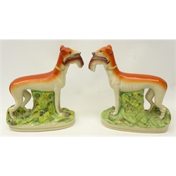  Pair of Victorian flat back Staffordshire greyhounds,holding rabbits in their mouths, H29cm     