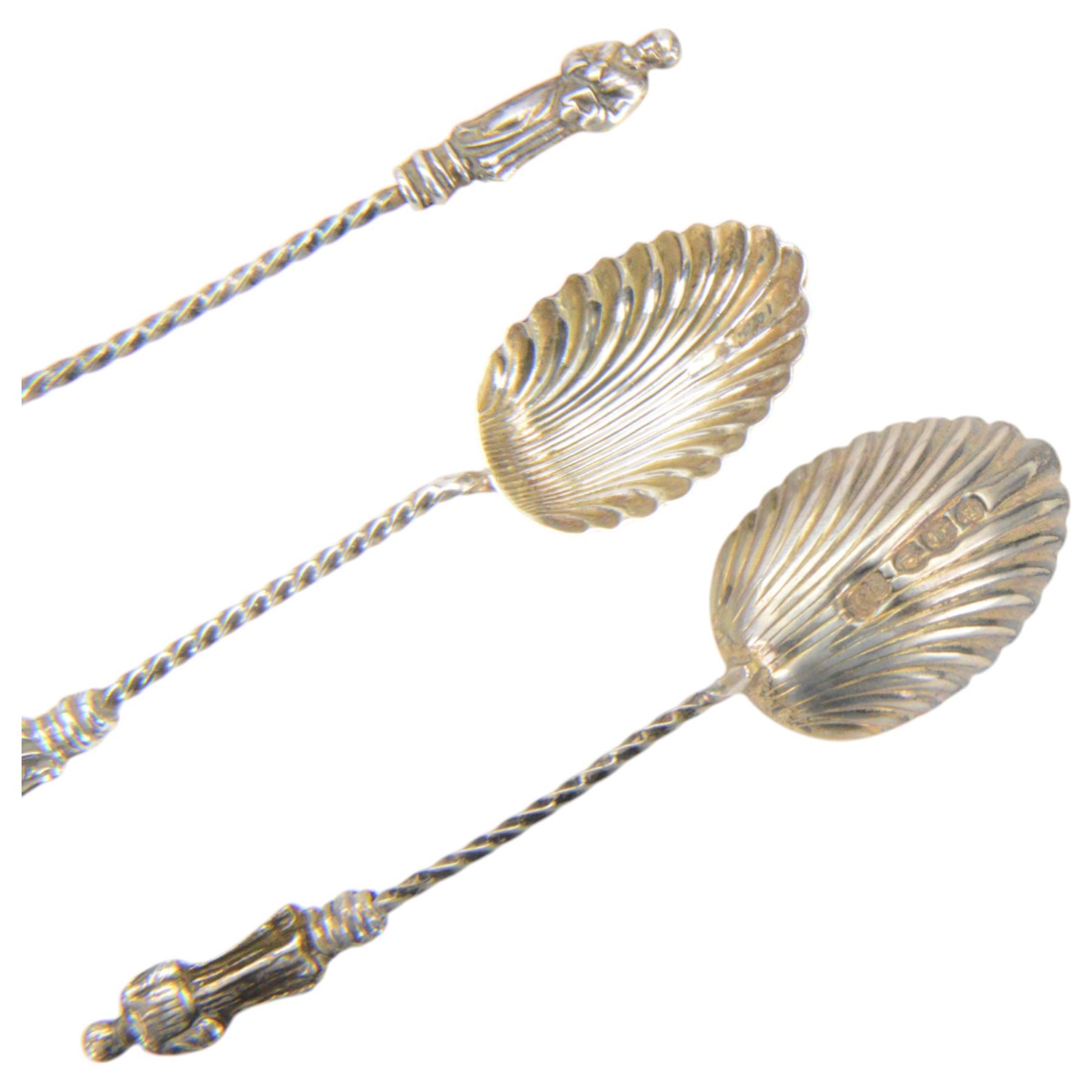 Edwardian silver sauce boat, of typical plain form with shaped rim, with flying C scroll handle and upon three pad feet, hallmarked Birmingham 1907, maker's mark worn and indistinct, together with a pair of Edwardian silver cruets, of urn form, upon three pad feet, hallmarked Horace Woodward & Co Ltd, Birmingham 1905 and a set of six silver apostle spoons, with matching sugar tongs and sugar sifting spoons, some hallmarked Miller Bros, London 1895 and Charles Boynton, all contained within fitted cases