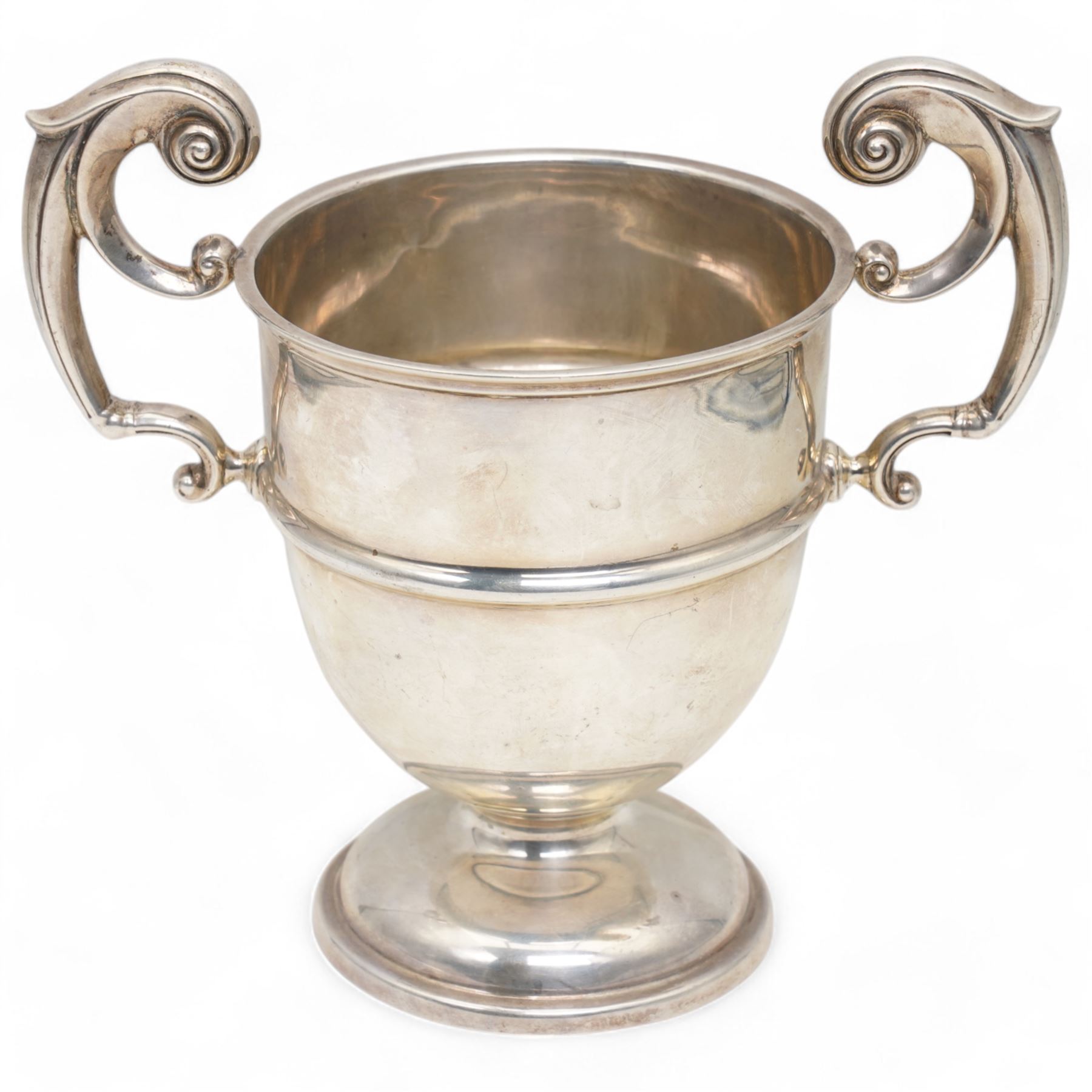 'The Albert Naylor Memorial Trophy' - A two handled silver cup with scroll handles and circular foot H19cm Sheffield 1927 Maker James Deakin & Sons 