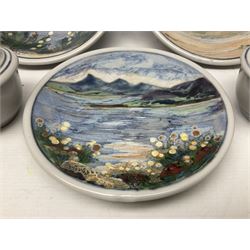 Highland Stoneware Scotland, decorated with landscapes and seascapes, comprising of two bowls, plate and two covered trinket boxes 