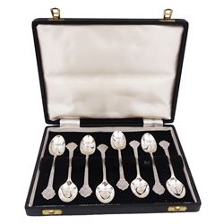 Set of eight modern silver teaspoons, each with cast Celtic style decoration, hallmarked Cooper Brothers & Sons Ltd, Sheffield 1960, contained within a tooled leather fitted case 
