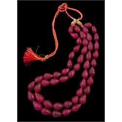 Double strand earth mined carved ruby bead necklace, with adjustable chord