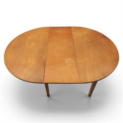 Mid 20th century teak extending dining table, together with eight teak chairs with green leather seats, extends to 154cm
