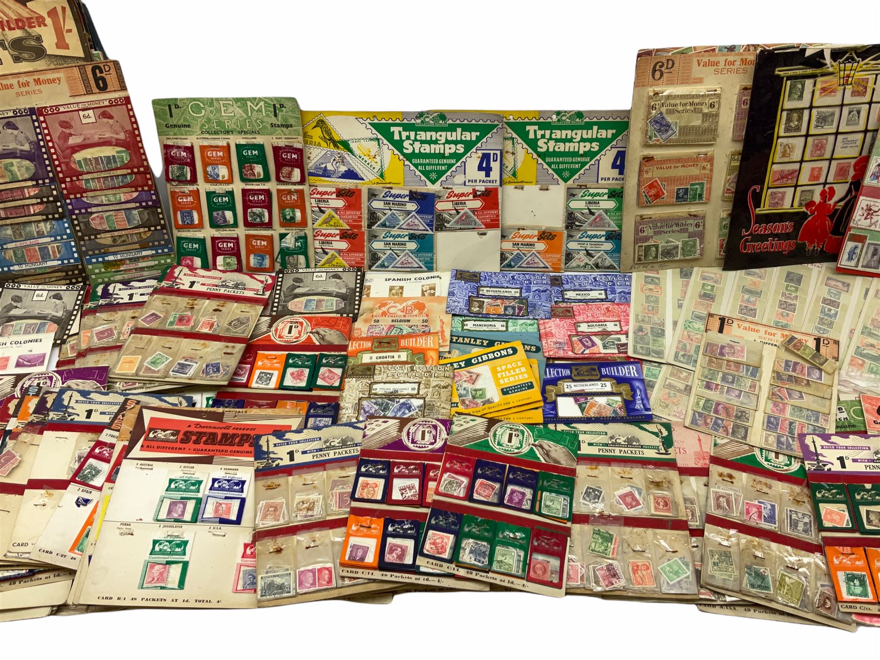 Collection of stamps including packets still mounted to the original shop cards, reading 'A Darracott Product Stamps 1d per pkt' etc, Countries include China, Spain, Argentina, Liberia, Denmark etc, in one box