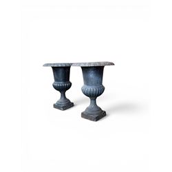 Pair of Victorian design heavy cast iron garden urns, black painted, egg and dart rim on waisted column