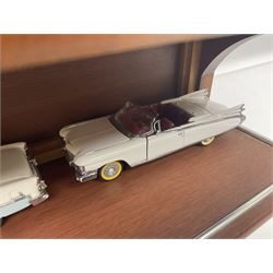 Franklin Mint 'The Classic Cars of the Fifties' collection with display rack, eleven (ex.12) die-cast models and folder of paperwork; another wall mounting display cabinet containing fifteen die-cast models; and an unused boxed Master Tools model display case