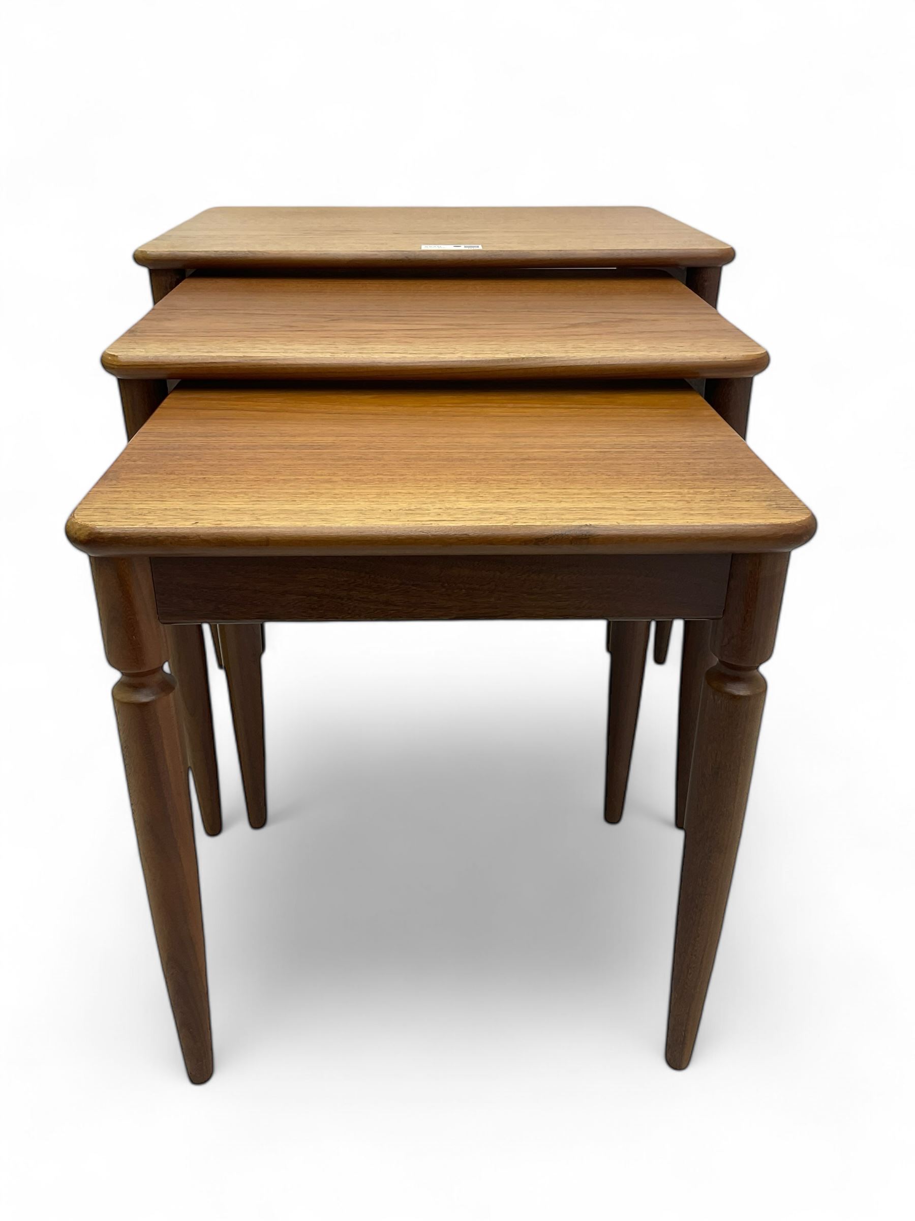 G-Plan - teak nest of three tables, rectangular top raised on turned supports