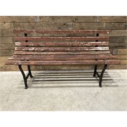 Wrought metal and wood slatted garden bench