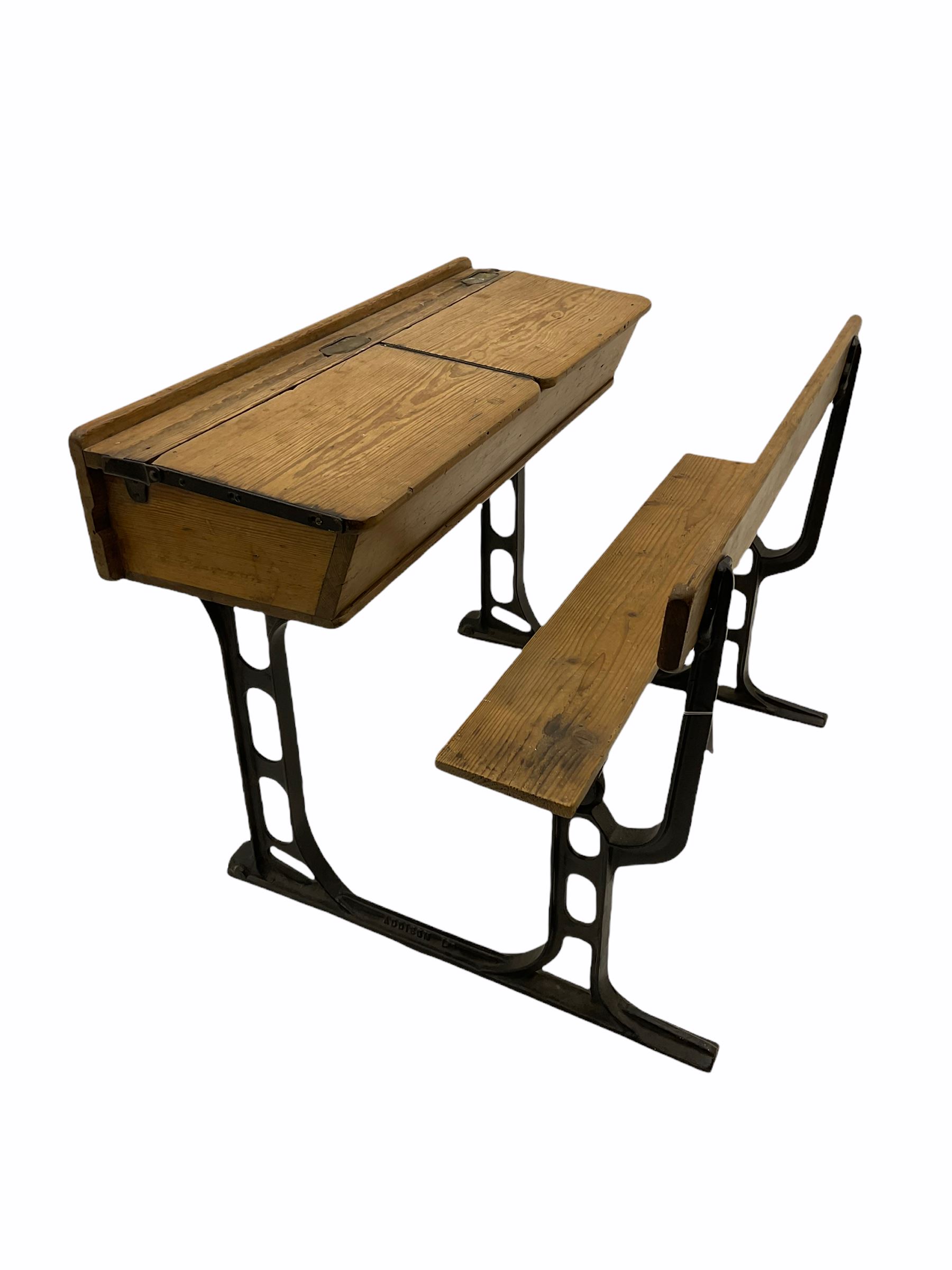 Early 20th century school desk, pine and cast iron, two sectional with hinged lids, the irons marked ‘Addision Ltd.’
