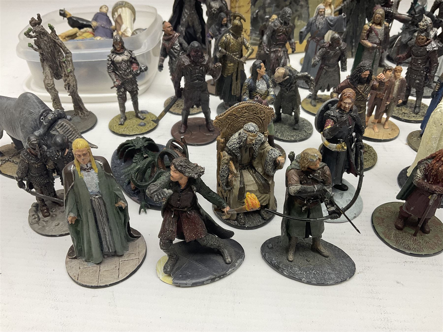 Approximately 80 NLP Lord of the Rings heavy metal painted figurines to include Fell Beast, boxed, and The Watcher, The Dark Lord Sauron, Treebeard etc, and unassociated Dracula themed composite figures marked HHFT50 