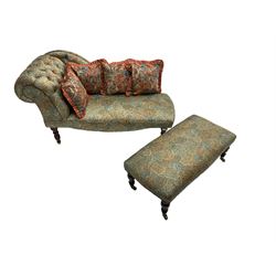 Chaise longue, scrolled back, upholstered in buttoned Liberty style peacock fabric, raised on turned supports, (W140cm, H73cm, D57cm); together with matching footstool on turned supports with brass castors (W94cm, H37cm, D47cm) and four scatter cushions