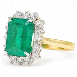 18ct gold emerald and diamond cluster ring, single octagonal cut emerald of approx 3.80 carat, surrounded by sixteen round brilliant cut diamonds, hallmarked, total diamond weight approx 0.50 carat