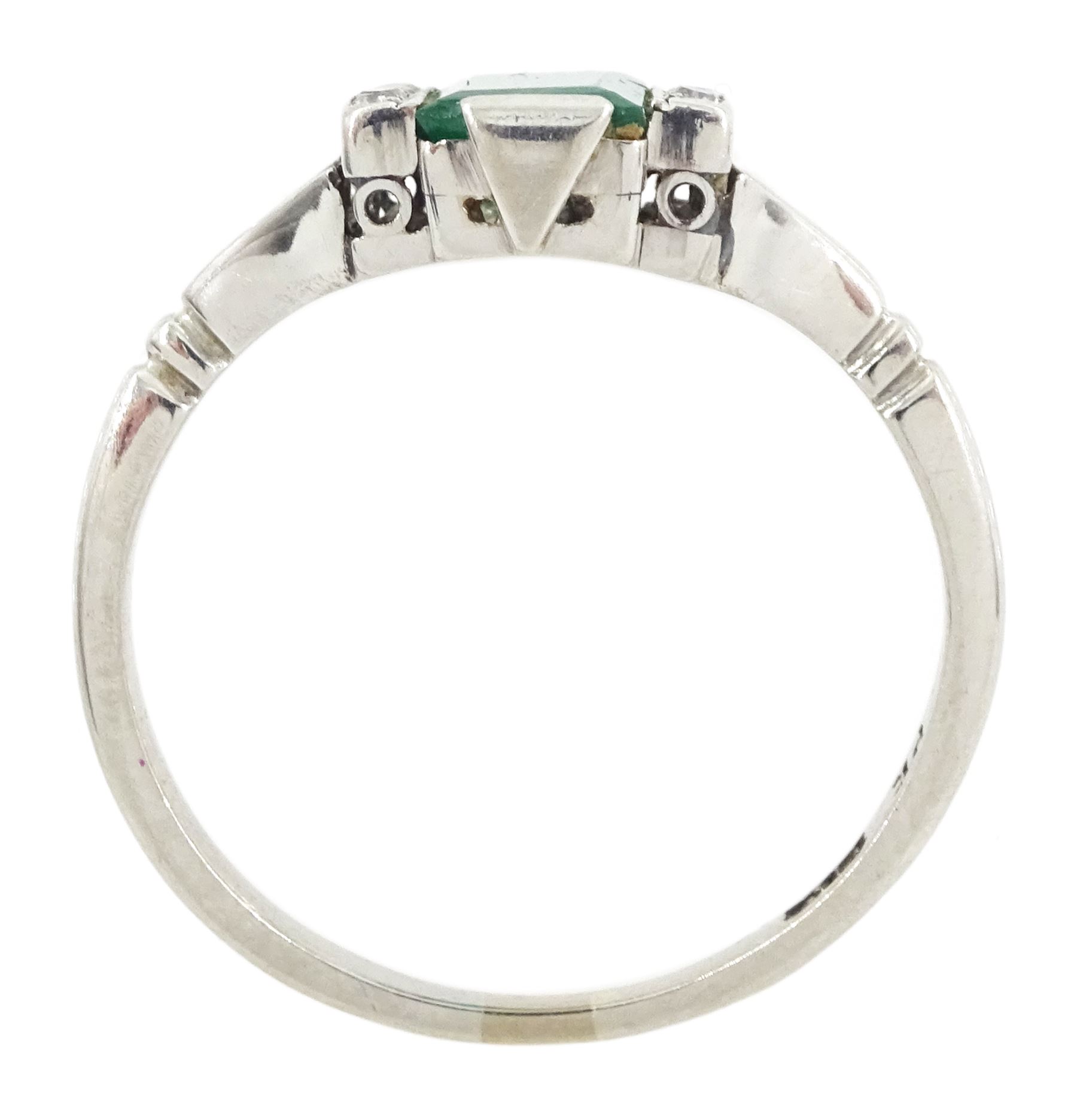 Early 20th century platinum emerald cut emerald and eight stone single cut diamond ring, stamped PT, emerald approx 0.70 carat