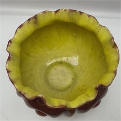 Bretby Jardiniere and stand, with foliate and foliage decoration with a red and yellow ground, impressed mark beneath H94cm