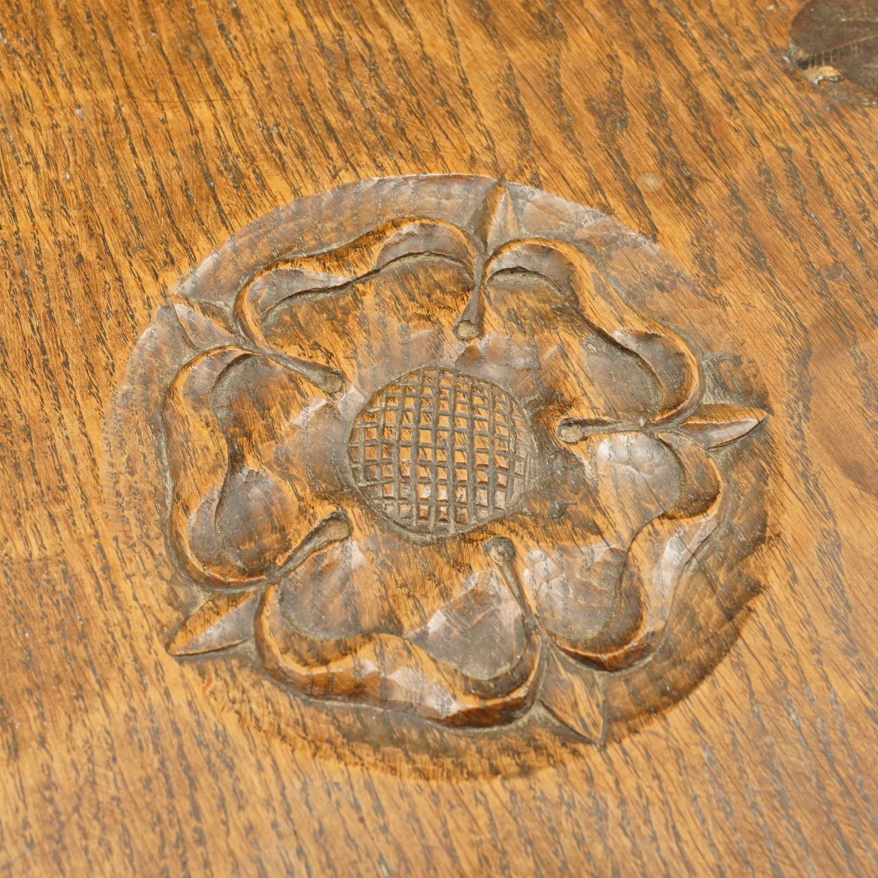 Gnomeman - circular adzed oak stool with carved Yorkshire Rose top, raised on three shaped supports carved with gnome signature, by Thomas Whittaker, Littlebeck, Whitby
