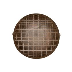 Circular riveted iron fire pit, strapwork sides with twin handles on stand, with grate