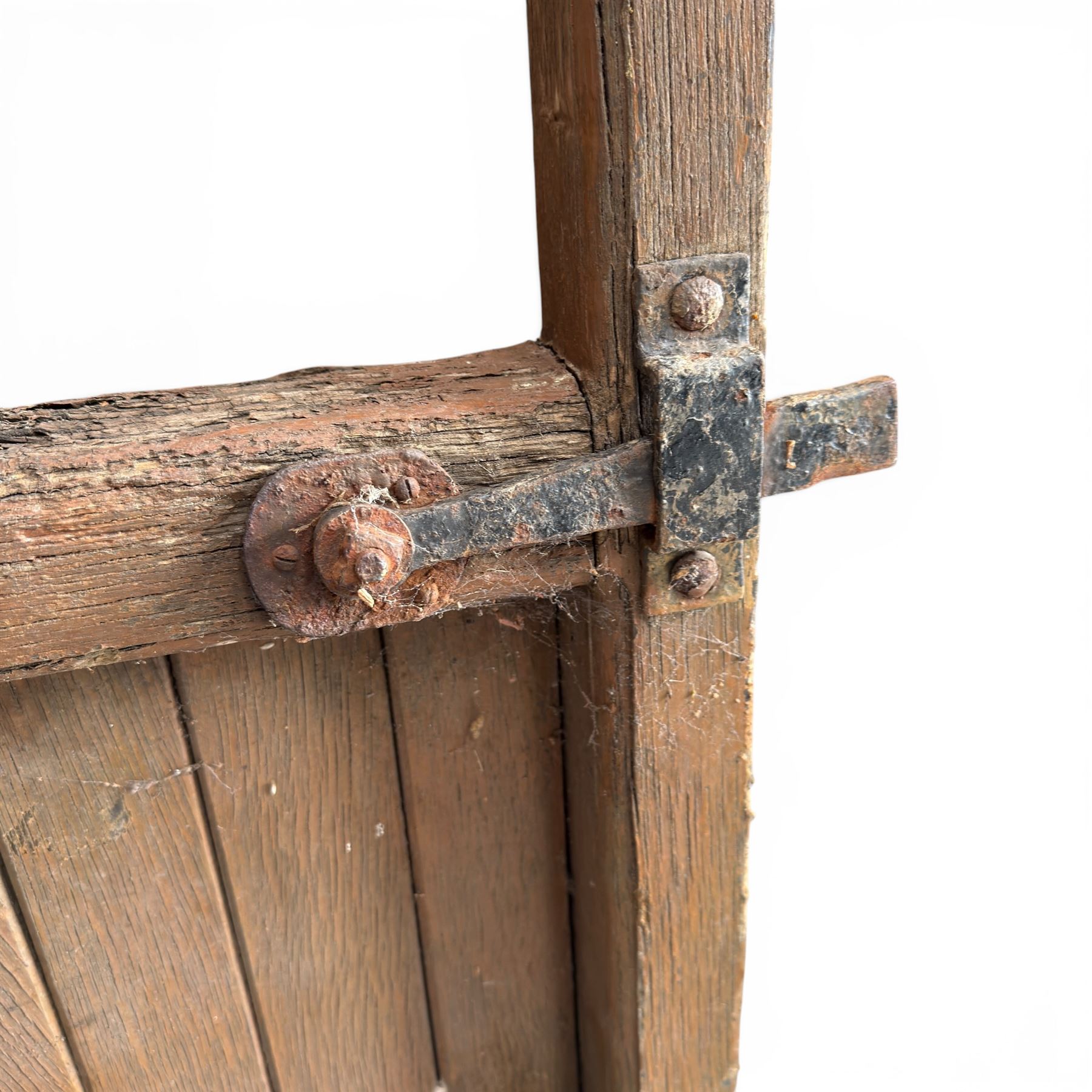 Pair of 19th century weathered wooden ecclesiastical church gates, the cresting rail over four pierced arches with slatted lower section, fitted with heavy cast iron hinges, latch and fittings