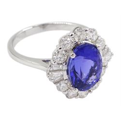 18ct white gold oval tanzanite, round and baguette diamond cluster ring, stamped 750, tanzanite 3.43 carat, total diamond weight 0.99 carat, with Gemological Institute Report