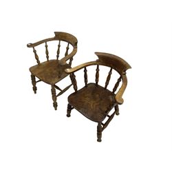 19th century elm and ash Captains smokers bow chair, spindle tub shaped back and saddle seat, raised on turned supports united by double H stretcher, together with a later oak similar chair